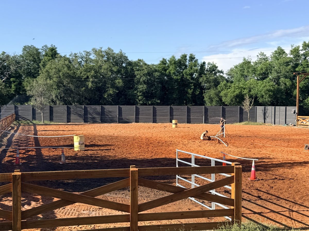 Finished riding arena with engineered base and footing built by Eco Equine
