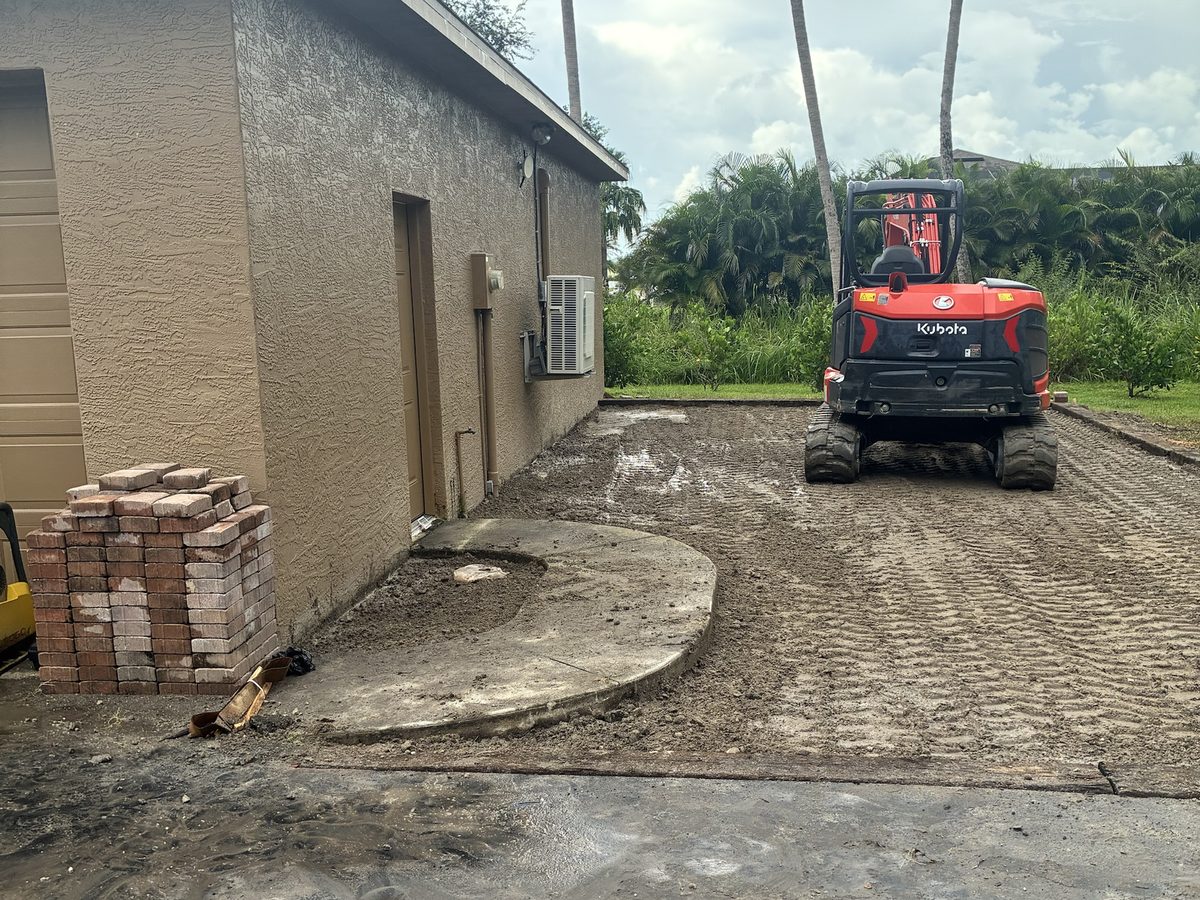 Compacted and graded building pad with Kubota excavator