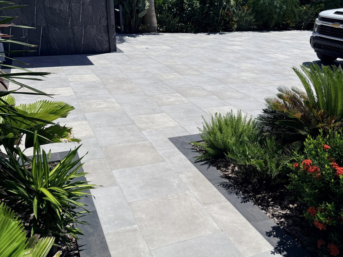 Finished paver walkway with clean borders and landscaping